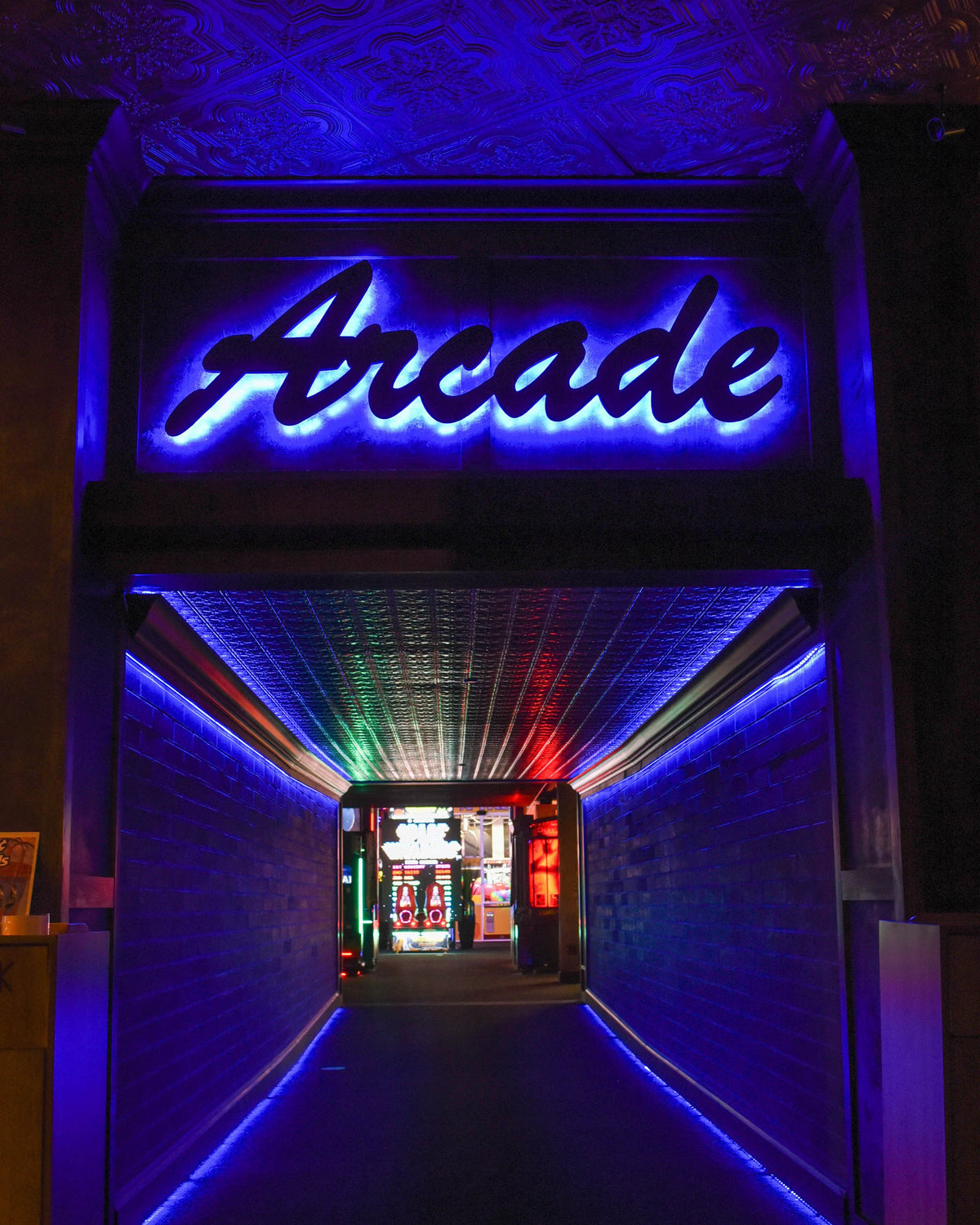 Arcade entrance with neon lights and gaming machines